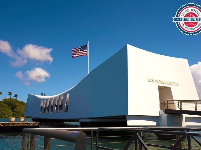 The USS Arizona Memorial building over the water with an official logo