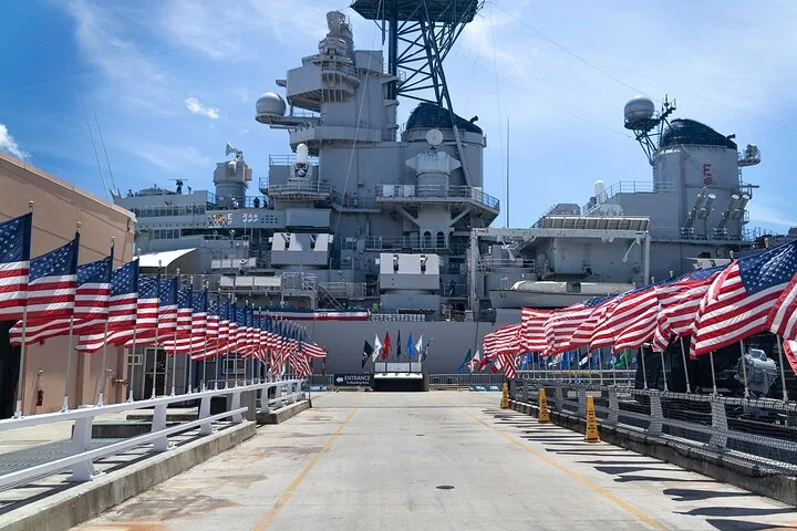 Entrance walkway to the Battleship Missouri lined with American flags